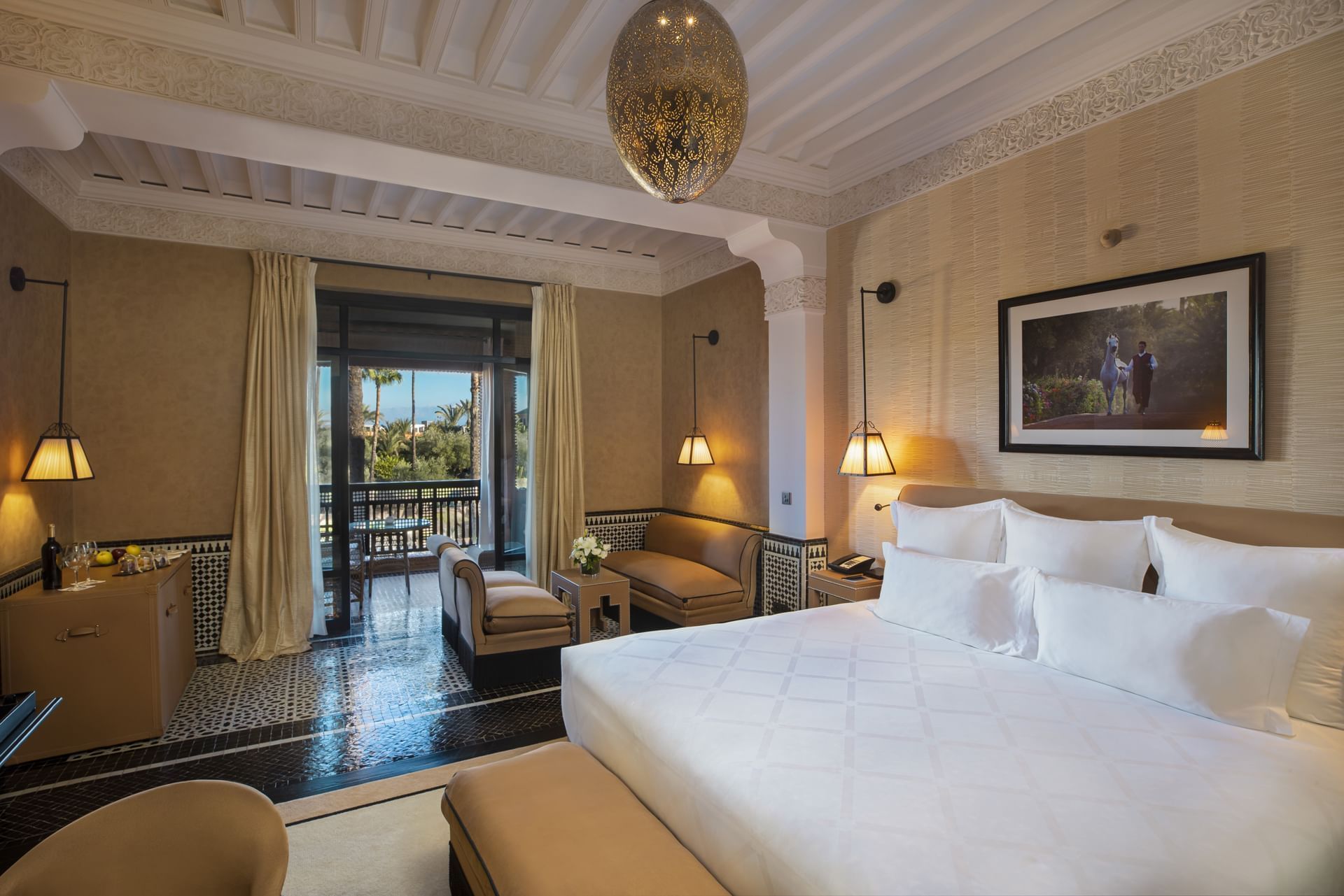 King bed & sofa in a suite at Selman Marrakech