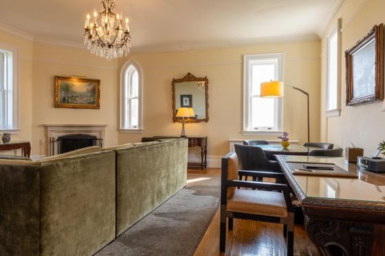 Sofa, working area with a chandelier at Castle Hotel and Spa