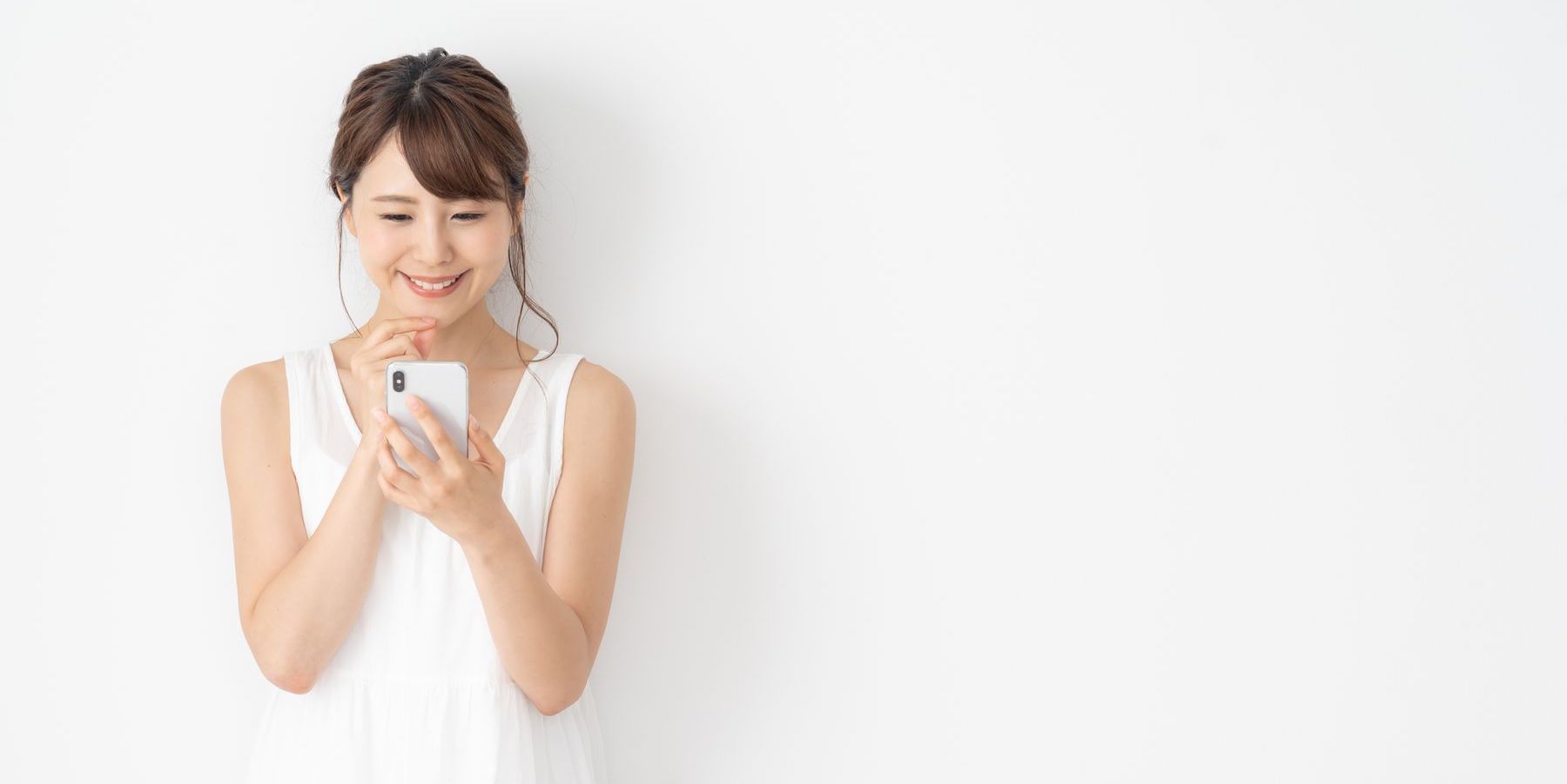 Woman smiling at phone