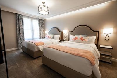 Nightstands by the beds in Accessible Double with carpeted floors at Hotel Atwater