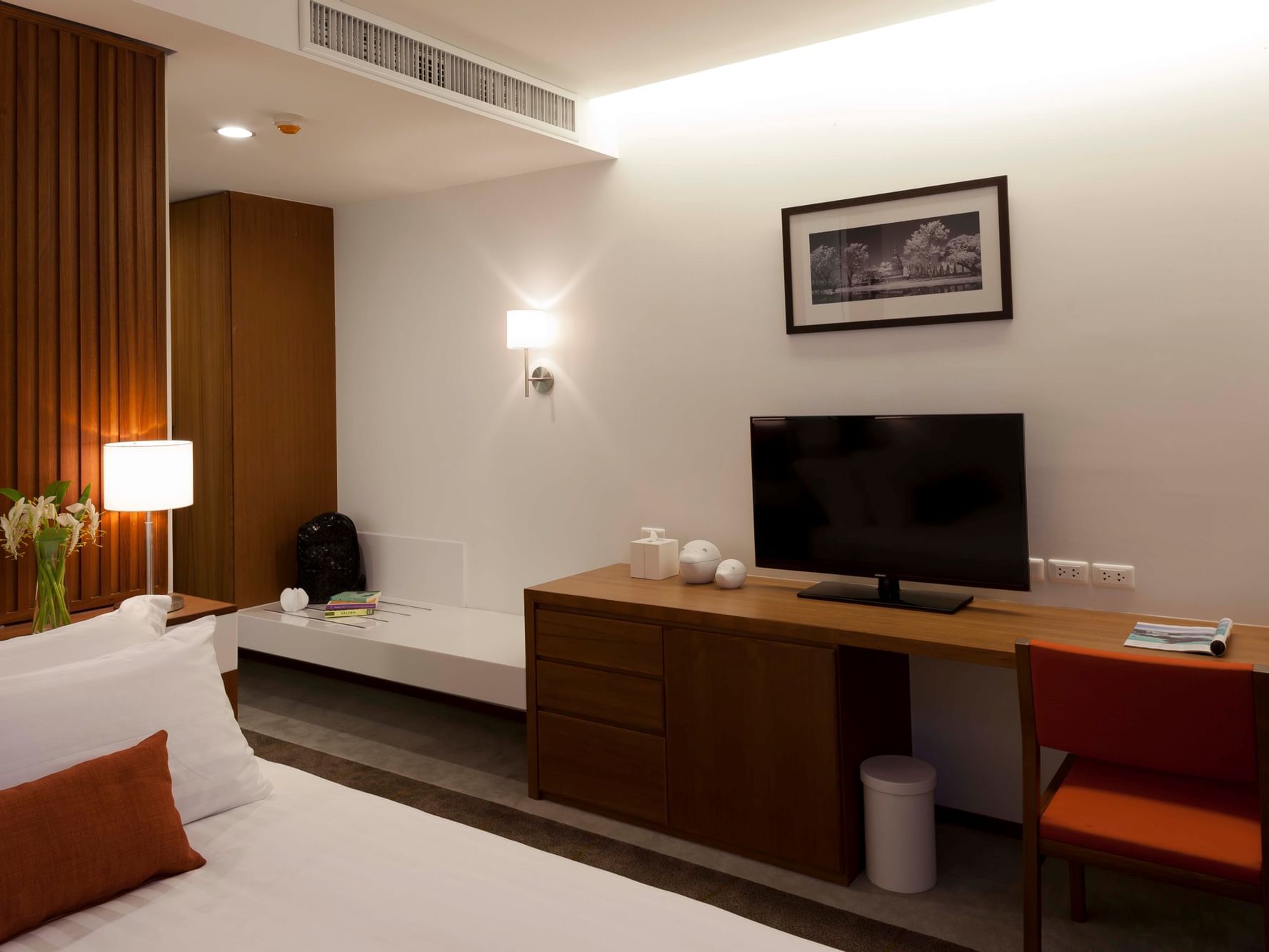 Superior Room with cozy bed and television at Eastin Tan Hotel Chiang Mai