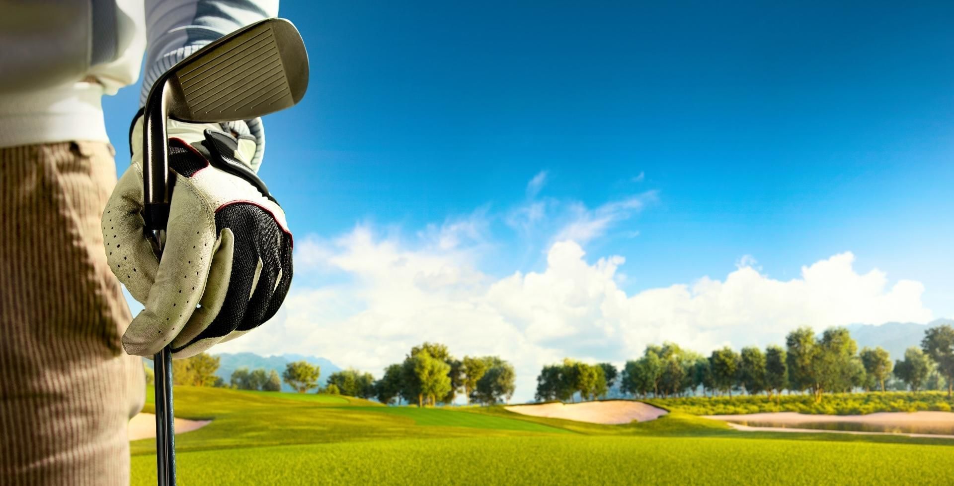 Man holding golf cue at a golf club in Woking