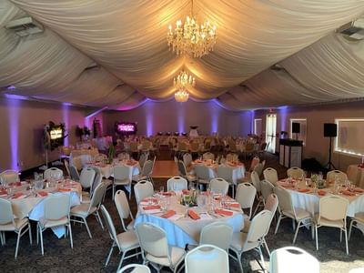 Grand Pavilion with chandeliers and elegant table settings at Lake Natoma Inn