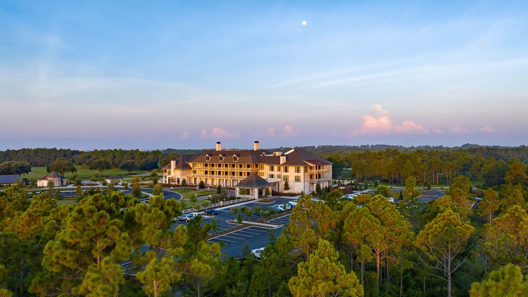 Aerial view of the hotel with lush greenery nearby at Camp Creek Inn