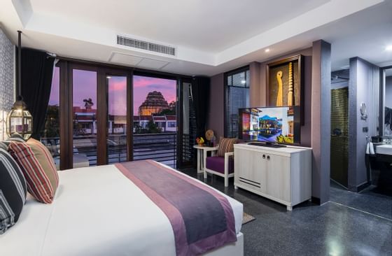 Room with a comfy bed, smart TV & balcony at U Hotels & Resorts