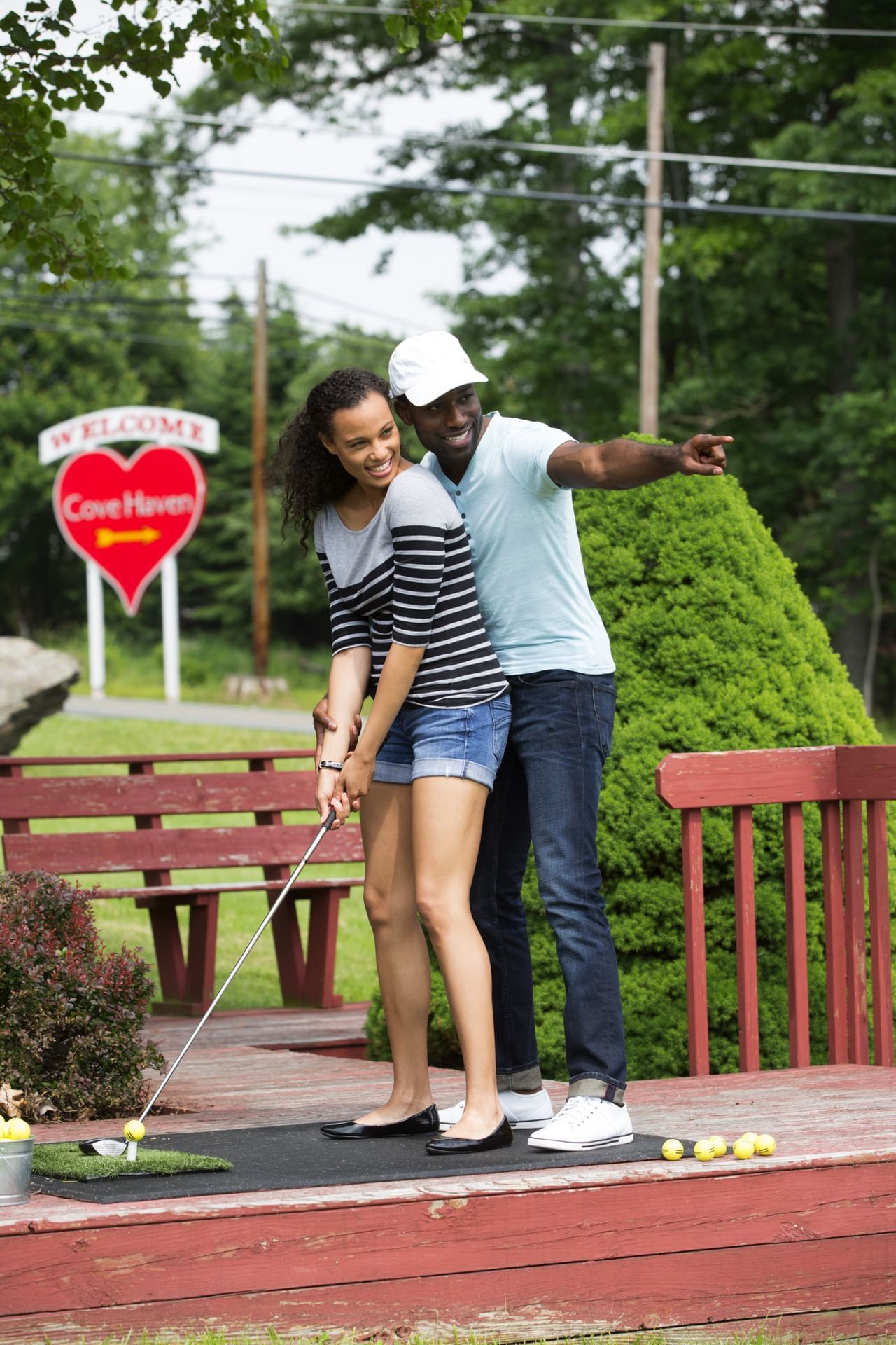 Couple playing Miniature Golf at Cove Haven Resort