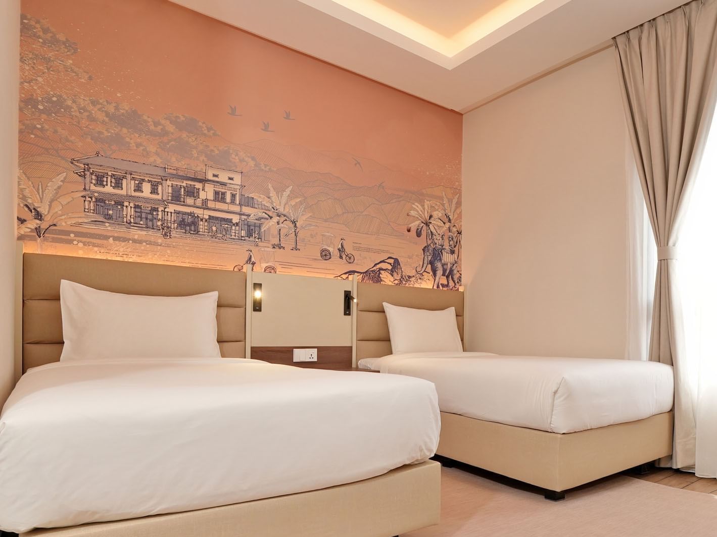 Cozy beds with cushioned headboards & a large wall mural in Deluxe Twin at Cititel Express Ipoh