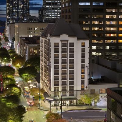 Aerial view of the hotel exterior & busy streets at night in Paramount Hotel Seattle