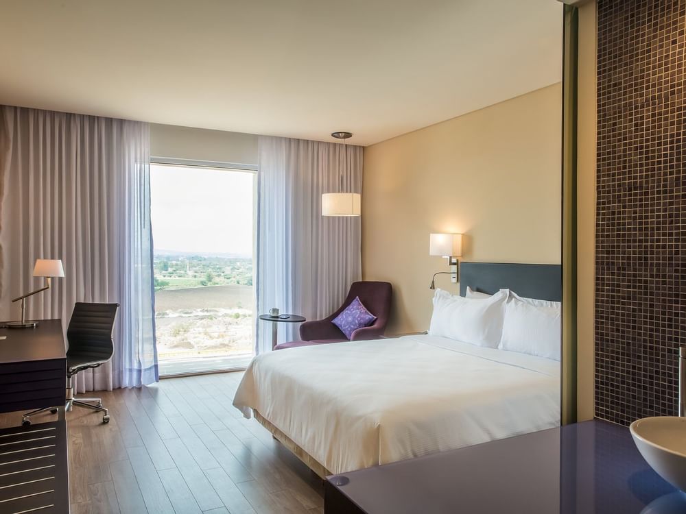 King bed in Superior Room with view at Fiesta Inn