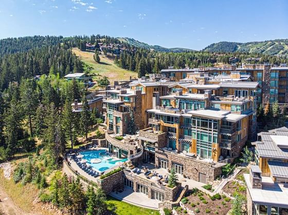 Exterior of Stein Eriksen Lodge surrounded by mountains