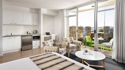 Living area and pantry area in an apartment at Be Fremantle