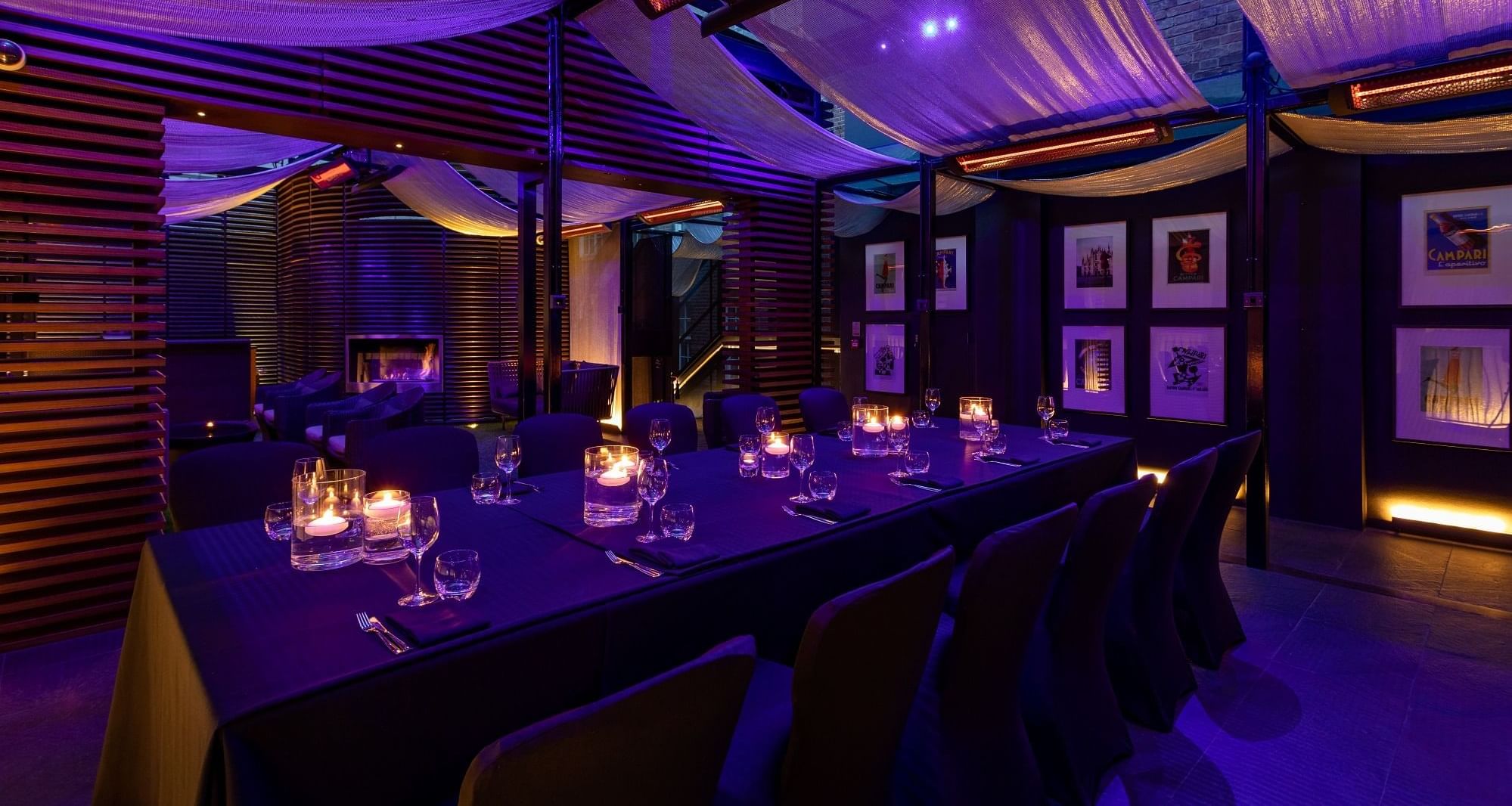 Private dining set-up arrangement in May Fair Terrace with purple lighting at The May Fair Hotel