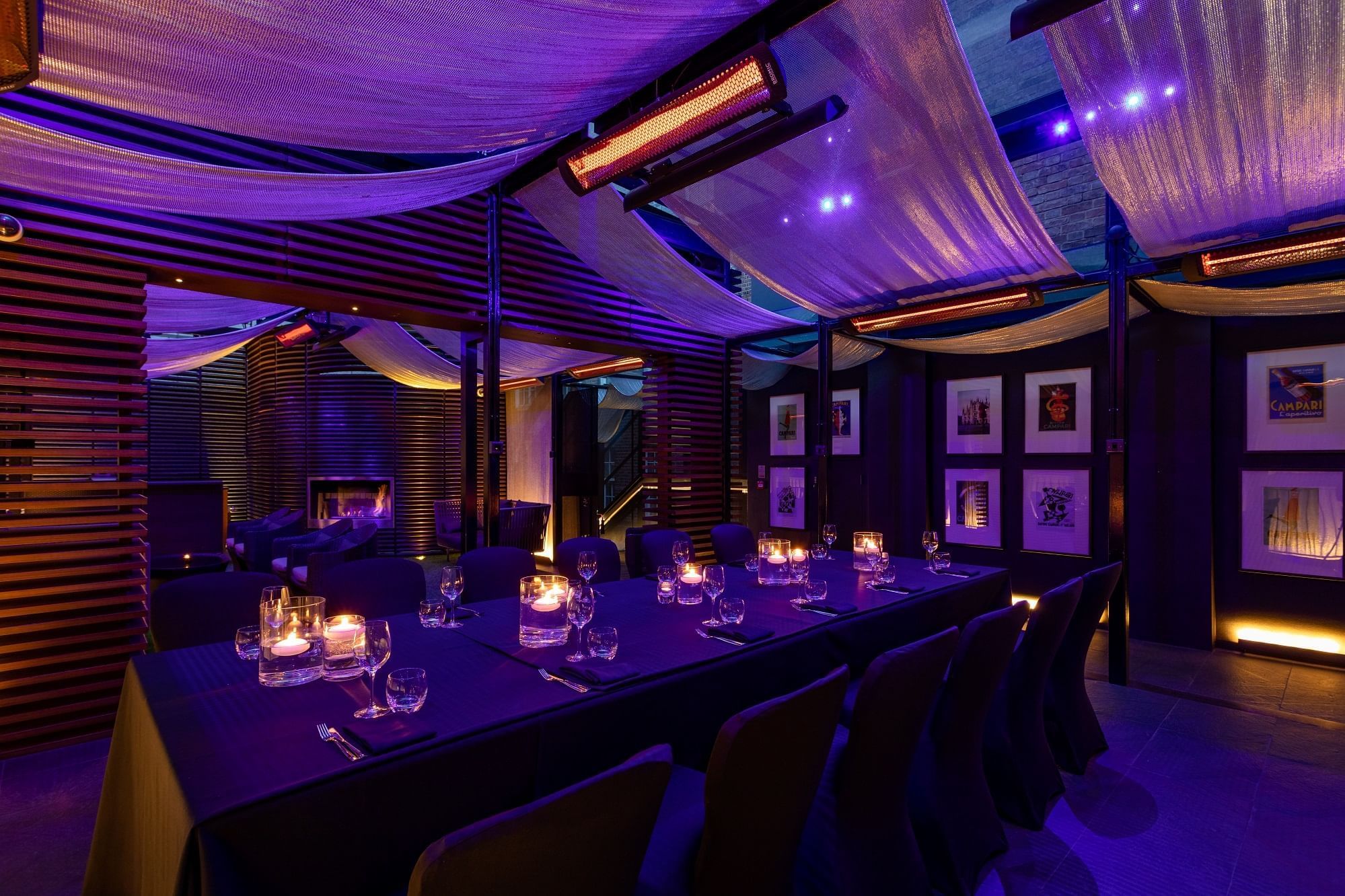 Private dining set-up arrangement in May Fair Terrace with purple lighting at The May Fair Hotel