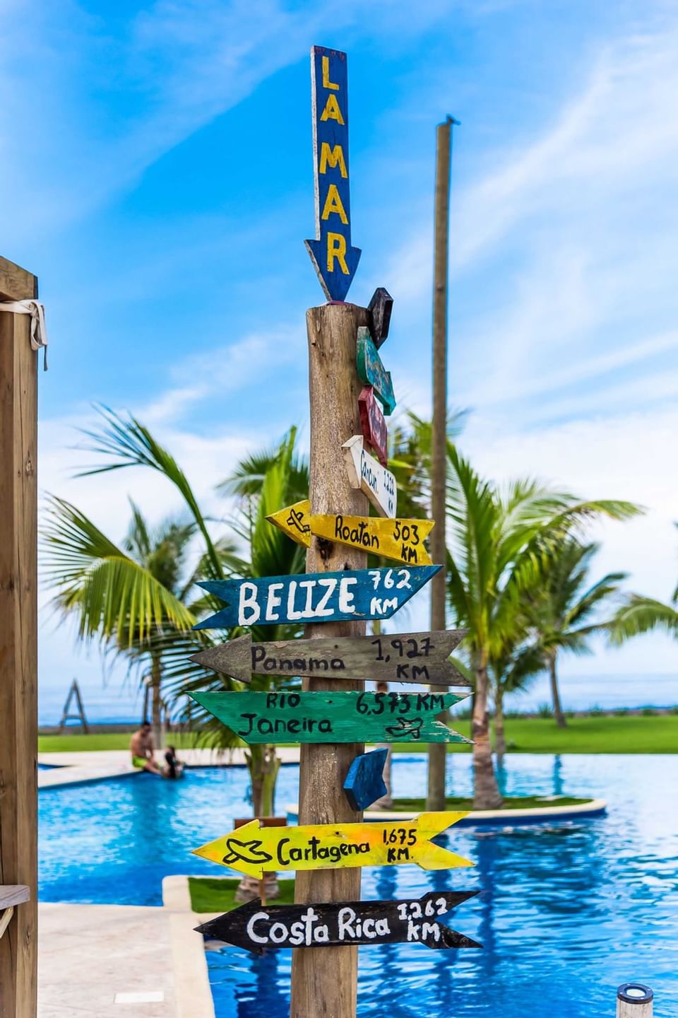Close-up of a pole with sign boards at La Mar Monterrico