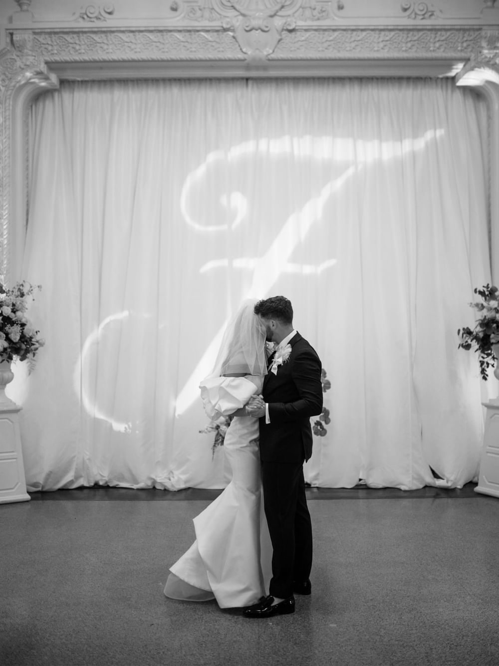 Bride & groom kissing in reception at The Mayo Hotel