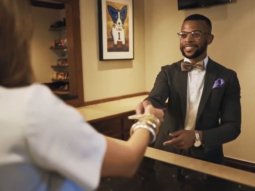 Concierge greeting guest at Cook Hotel