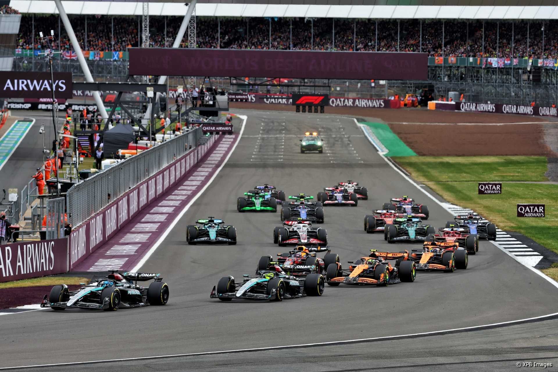Silverstone Grand Prix race near The Londoner Hotel, showcasing Formula 1 cars competing on the track