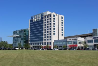 a building across from a freshly cut lawn