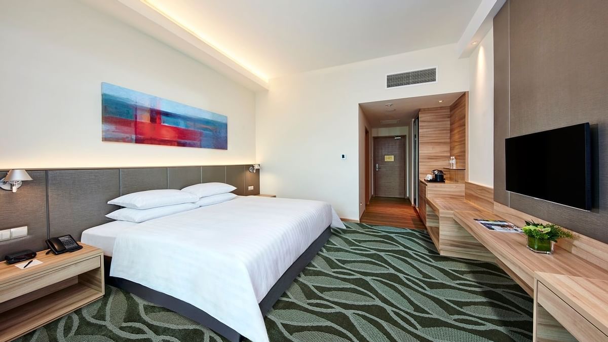 Tufted bed in Deluxe Plus King Room at Sunway Lagoon Hotel