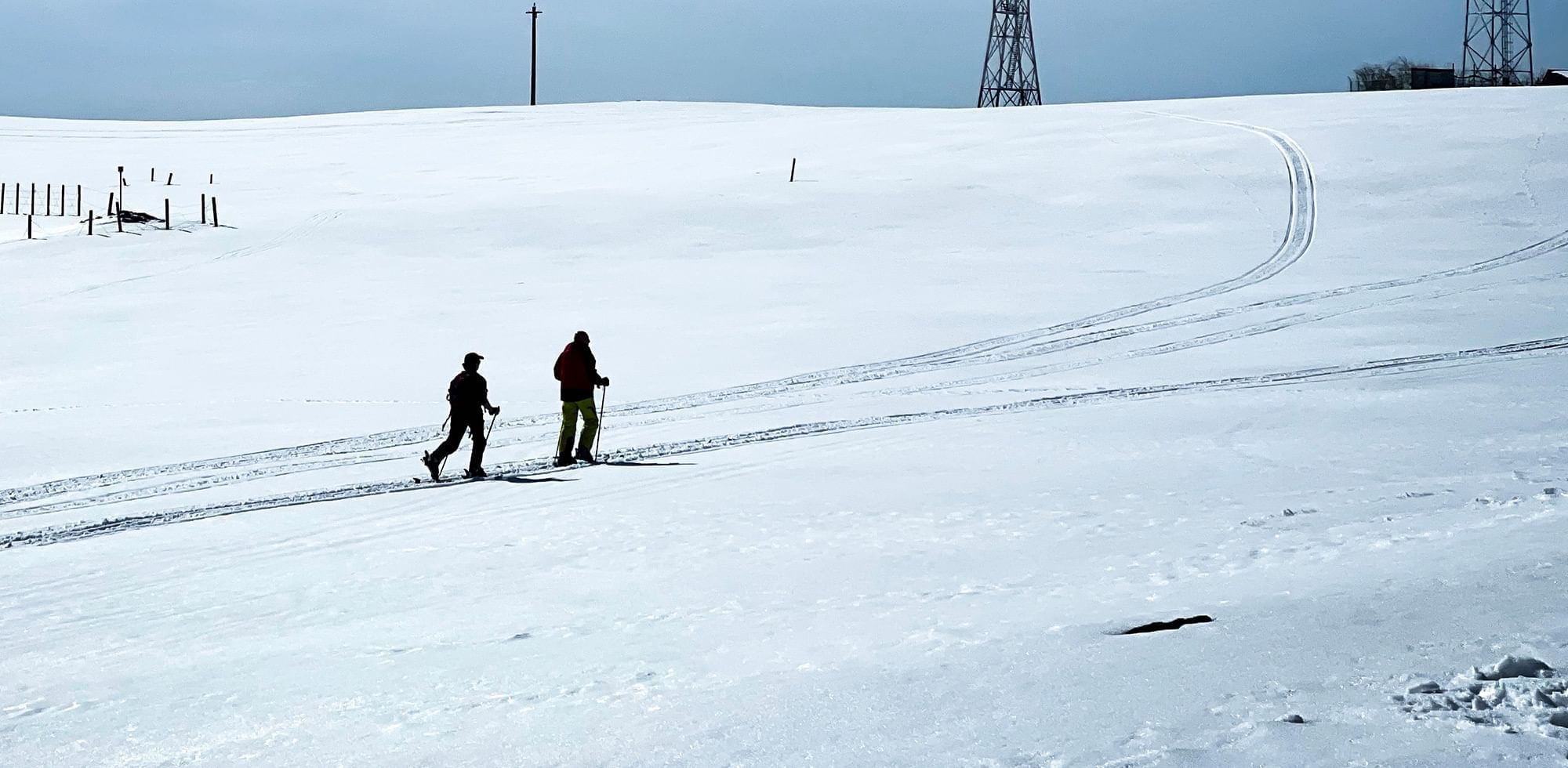 two people hiking in snow