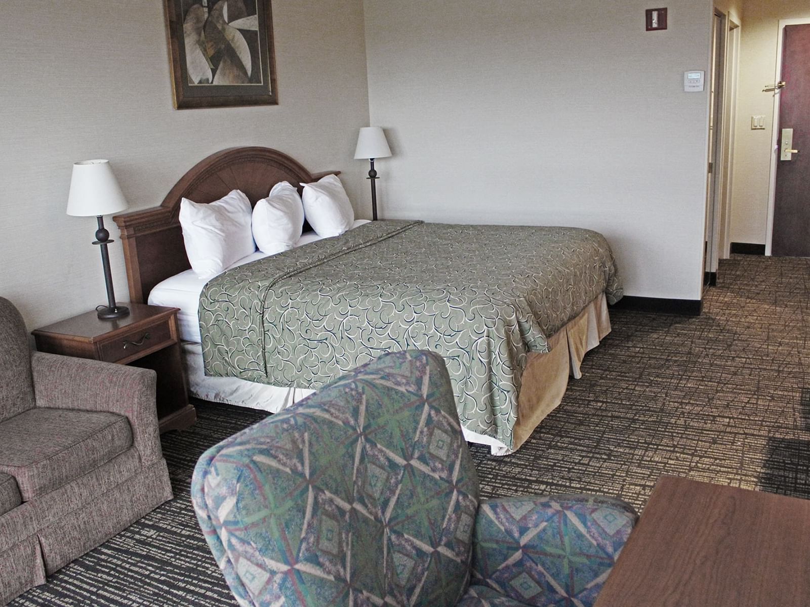 The Accessible Executive King Guest Room features a refrigerator, microwave, and a generous seating area with a sleeper sofa.