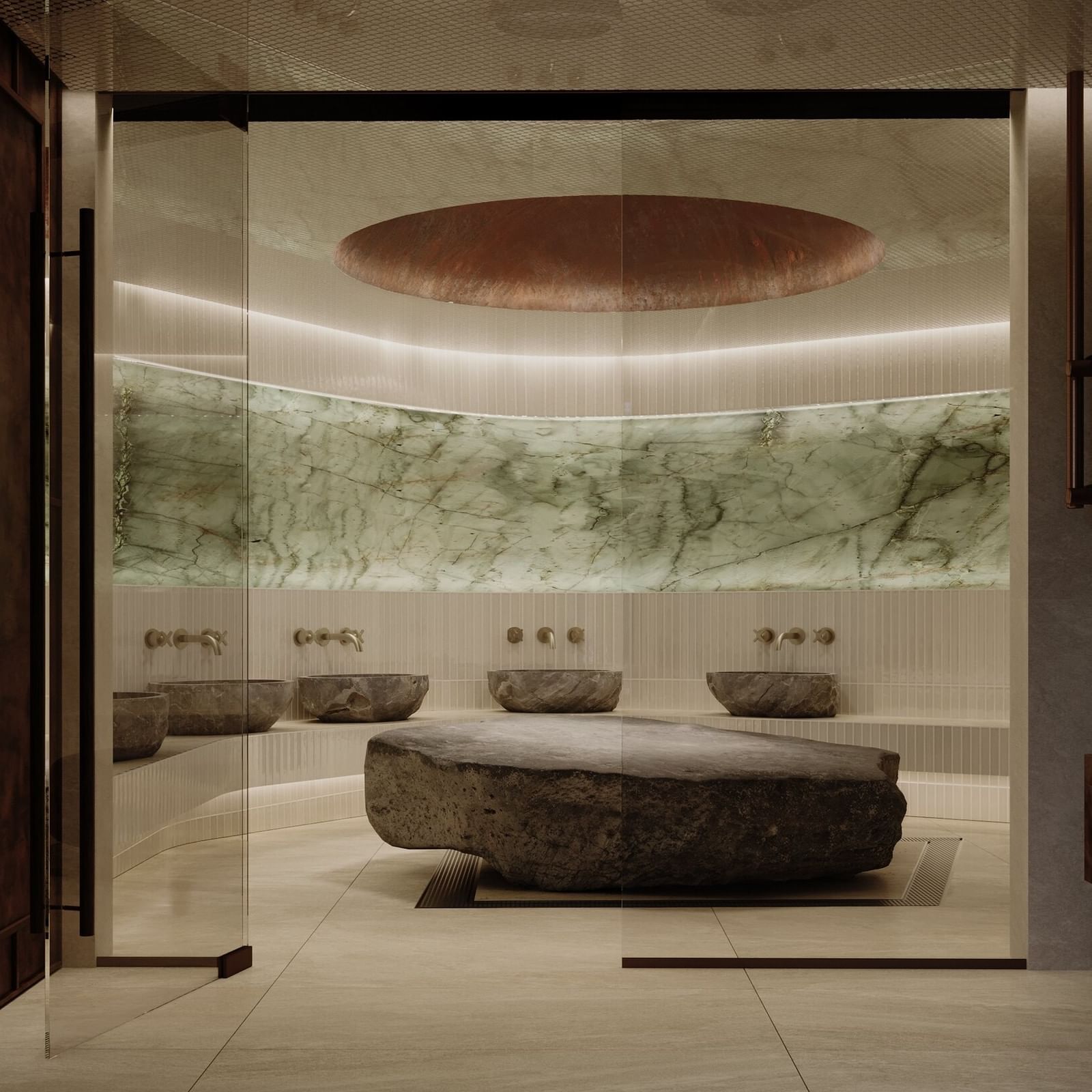 Modern Hammam spa room with large rock centerpiece and marble walls opening in 2027.