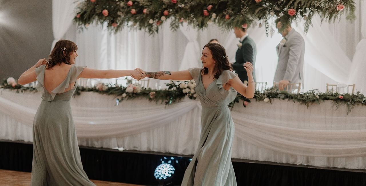 Wedding guests dancing in a venue