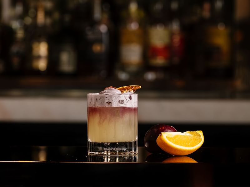 Drink served with orange at TWR at Crown Towers Sydney