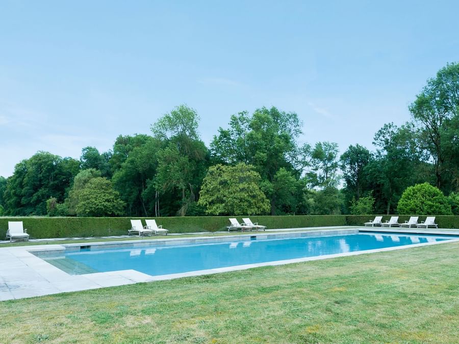 Sunbeds by the outdoor pool at Chateau de Perreux