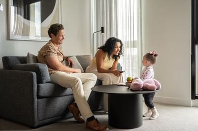 Family spending quality time in a Livingroom, Nesuto Docklands