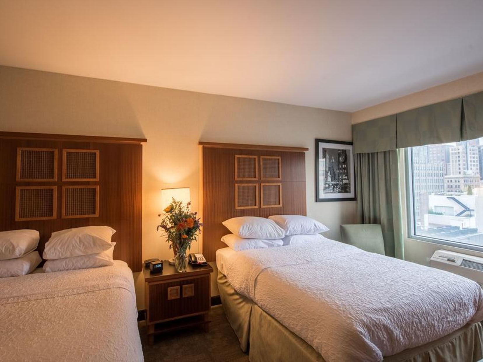 TriBeCa Doubles City View room at Soho 54 Hotel in NYC, featuring two comfortable beds and city views