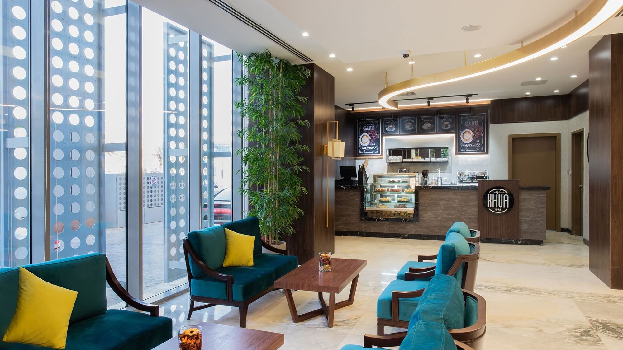Dining area with a counter in KHVA Café at Warwick Riyadh