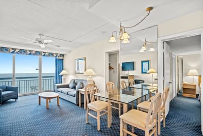 Living area and dining table in Grand Two Bedroom at The Yachtsman Resort