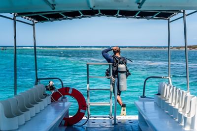 Scuba diver preparing to enter the water at Barefoot Cay Resort & Marina