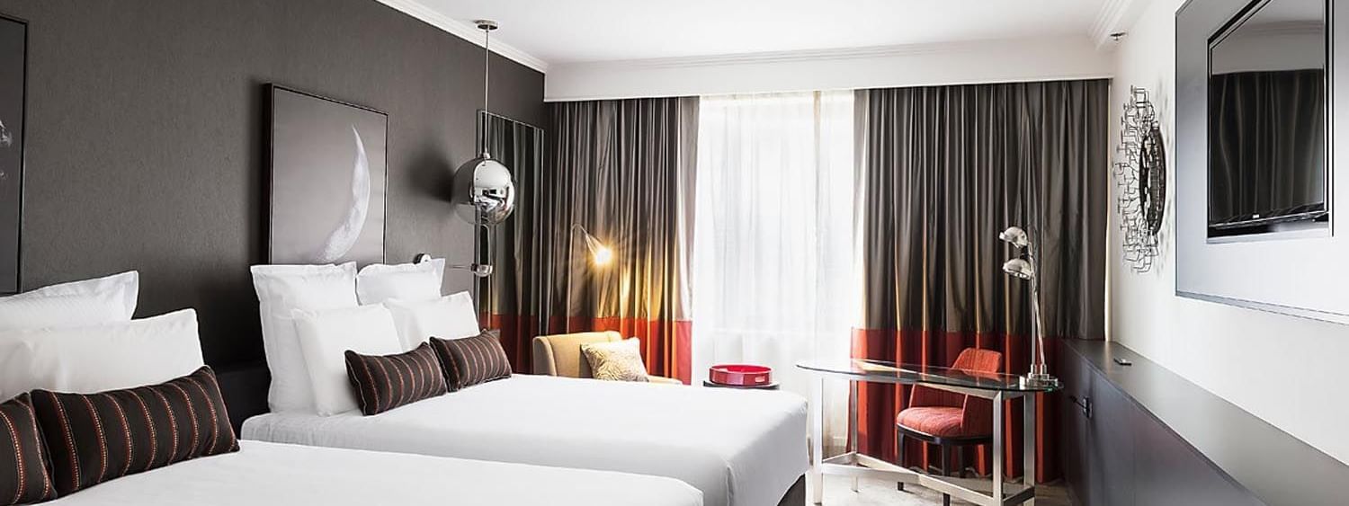 Queen beds and work area in Classic Room at Pullman Albert Park