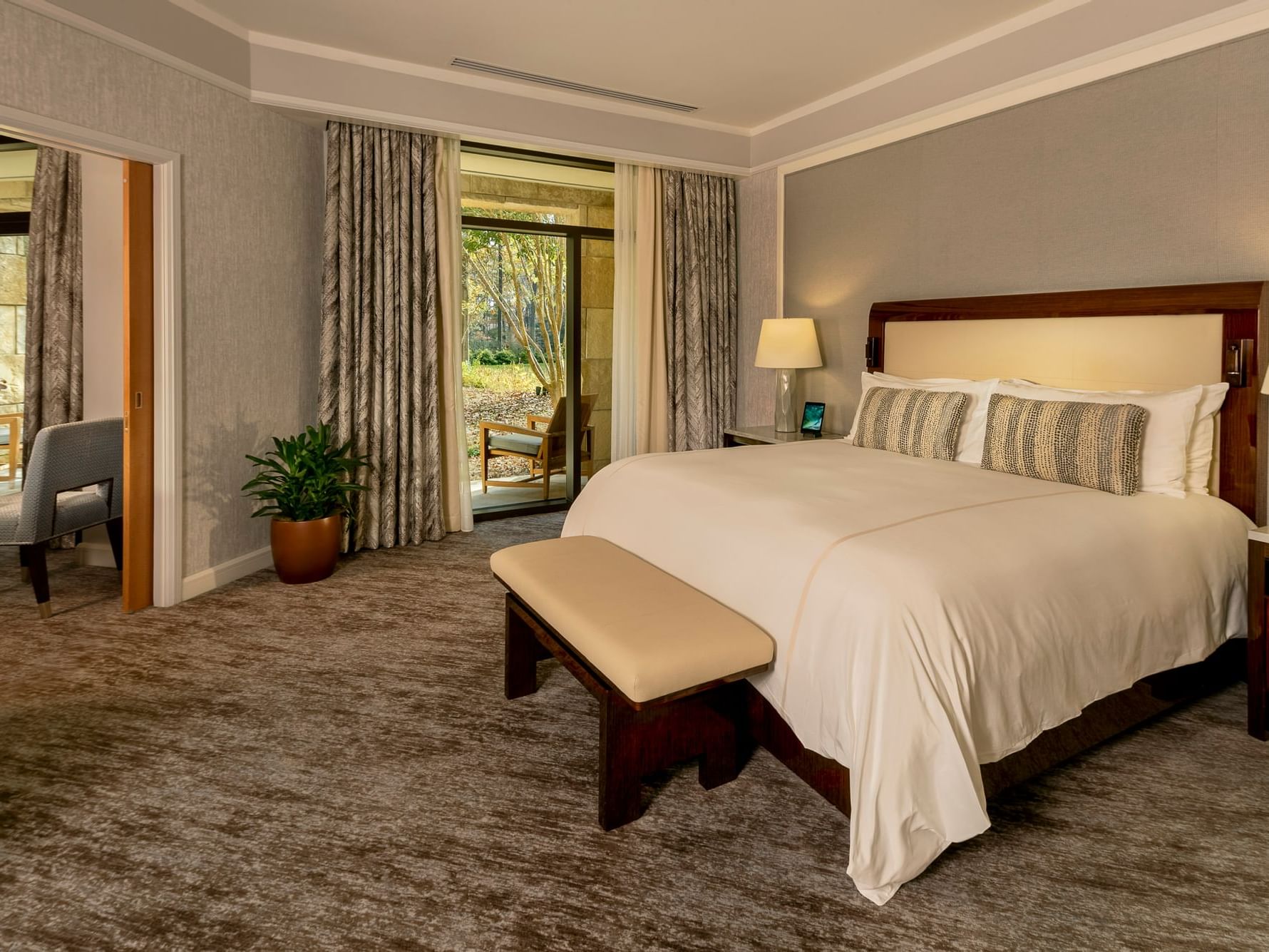 Interior of Signature Spa Level Suite with an expansive patio lounge at The Umstead Hotel and Spa