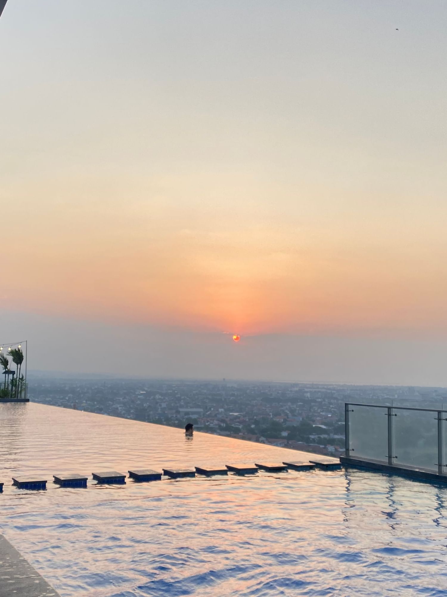 Infinity pool with a view of the sunset at LK Pemuda Semarang Hotel & Residences