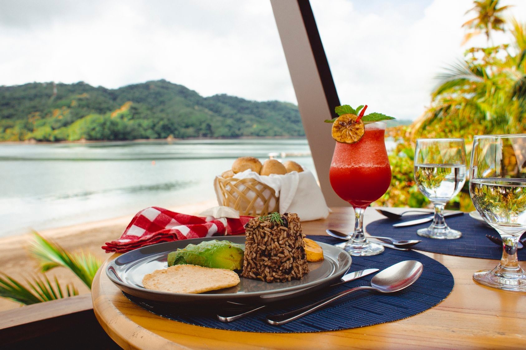 Gallo pinto served with cocktail in Donde Tía Nora Restaurant at Isla Chiquita Glamping Hotel