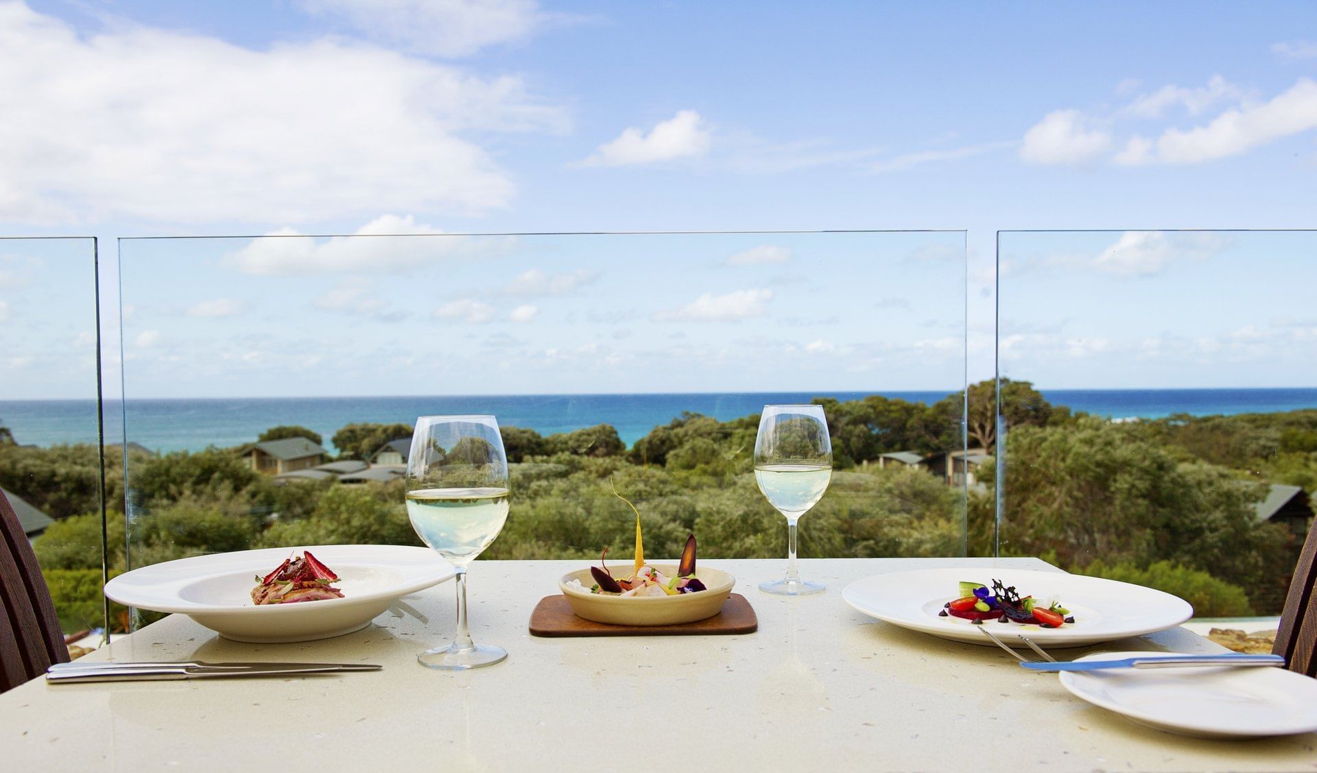 Dining Table With Food and Wine at Pullman Bunker Bay Resort