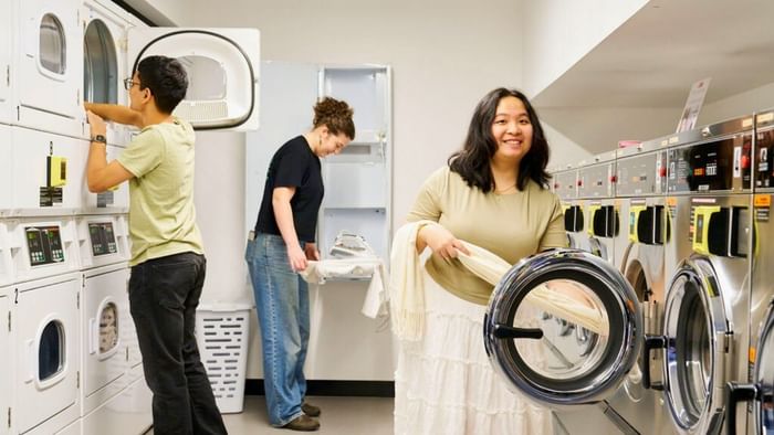 Guests using the laundry facilities at UniLodge Royal Melbourne in North Melbourne.