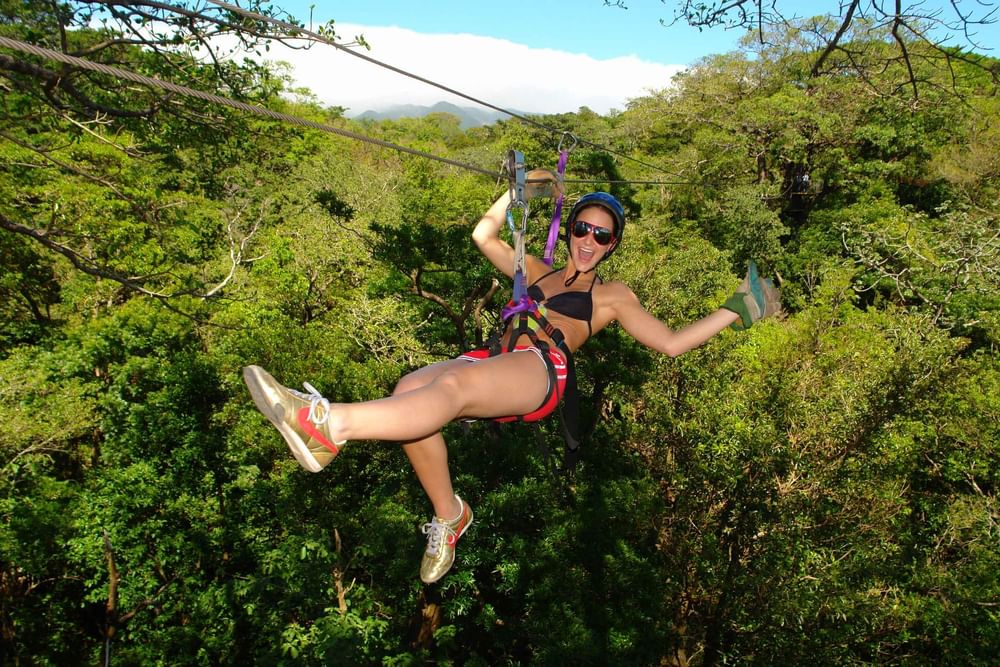 Zip lining above the tropical rainforest at Buena Vista del Rincón