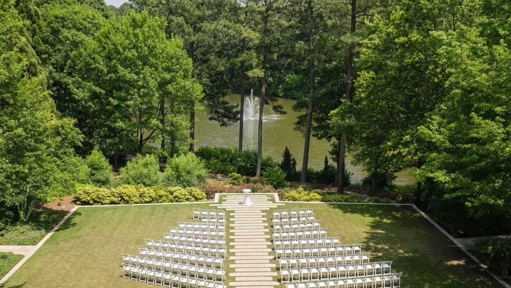 wedding lawn with chairs and views of nature and fountain
