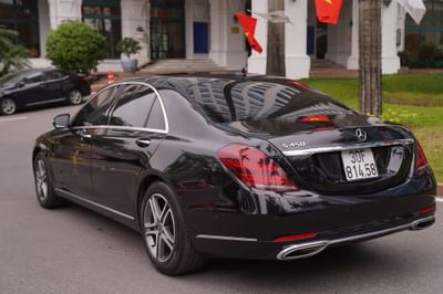 Luxurious Mercedes Benz parked in front of a Hanoi Daewoo Hotel