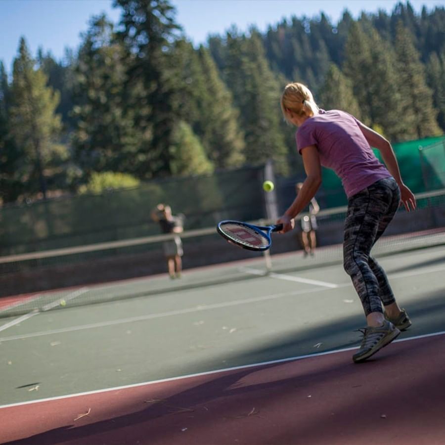A woman playing tennis at Granlibakken Tahoe