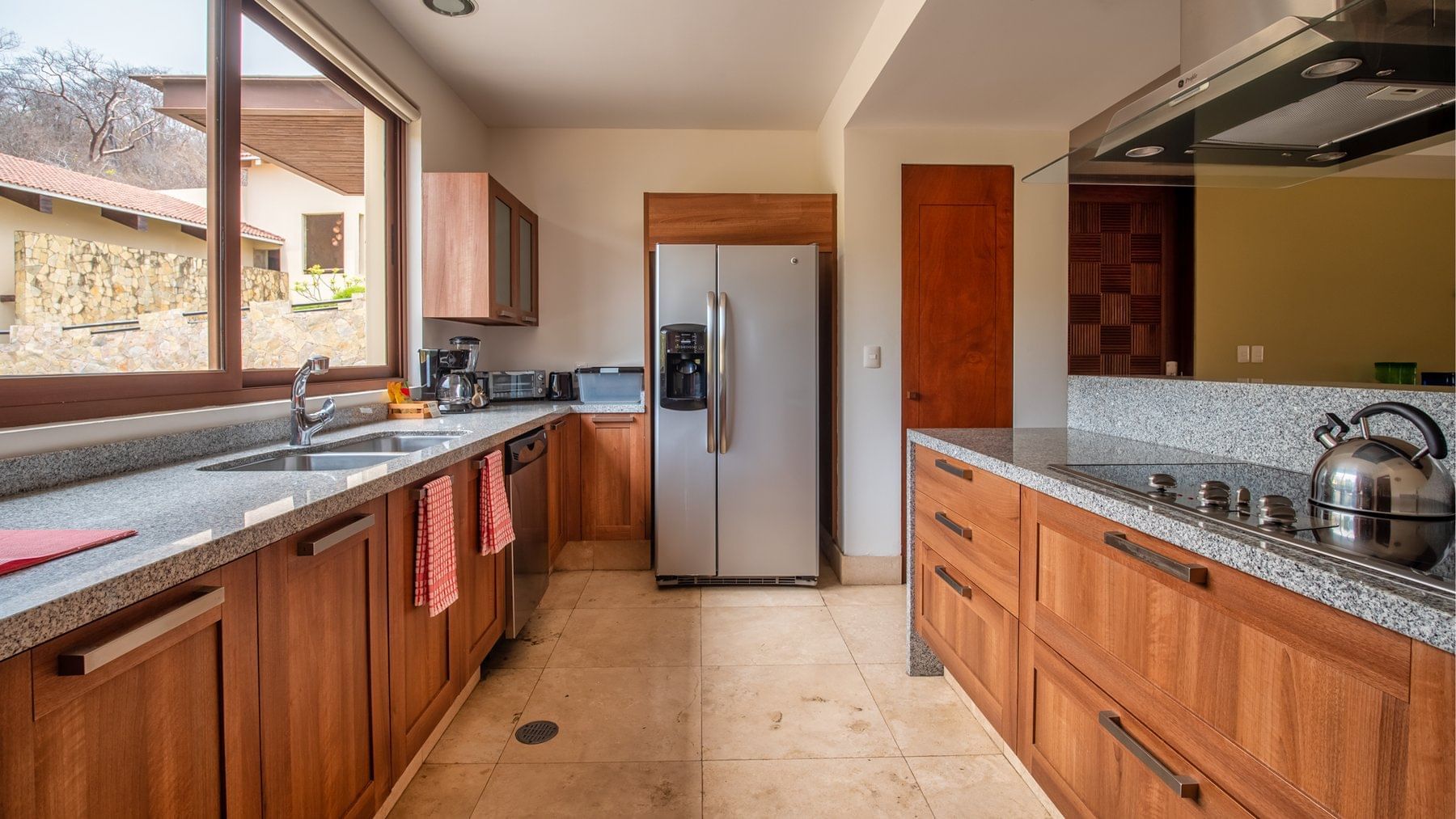 Kitchen area with granite counter at Celeste Beach CC Hotel