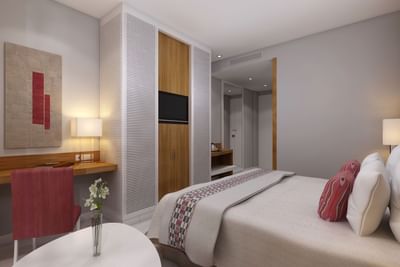 Large bed with working space in a room at Azalai Hotel Dakar