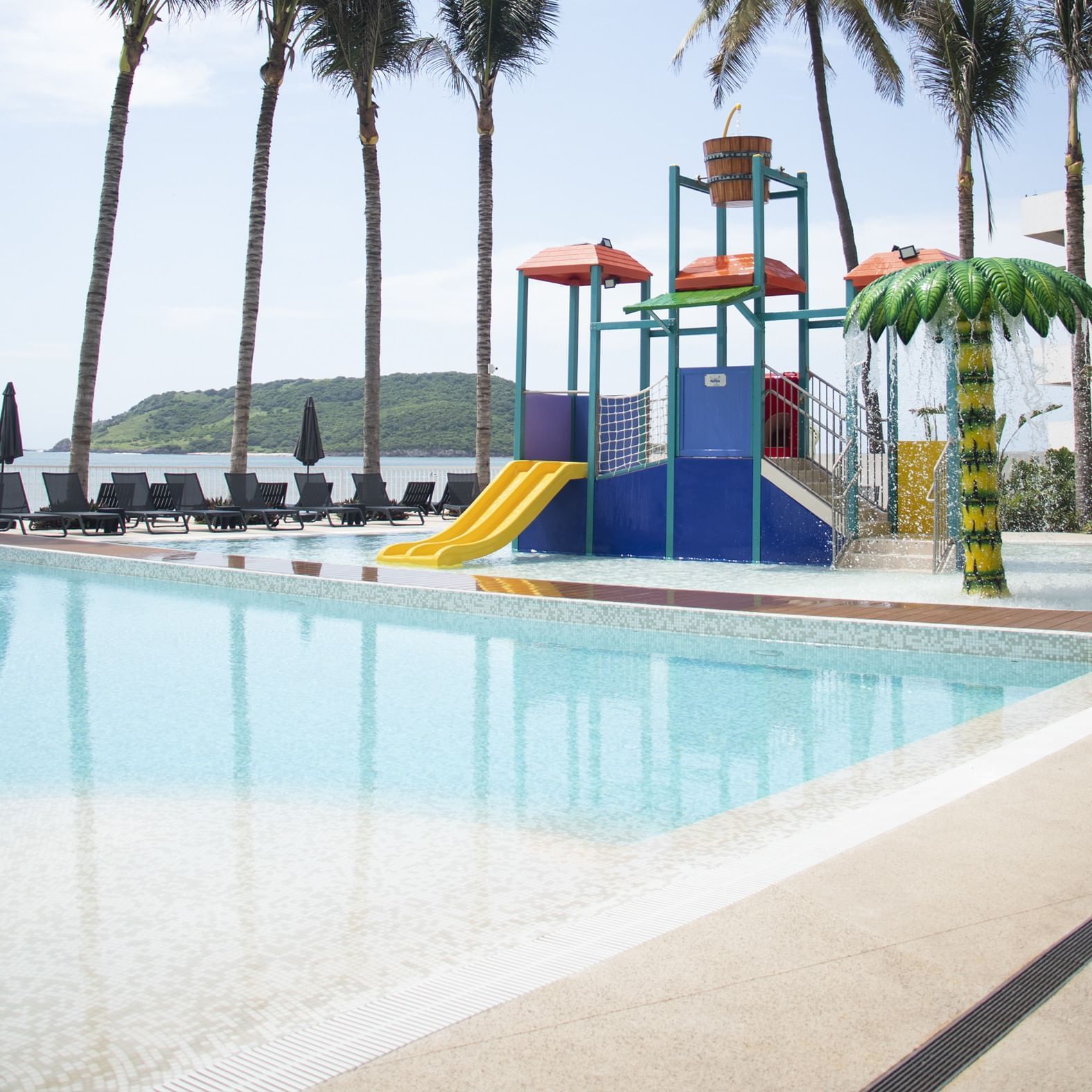 Kids' play area near the pool at Viaggio Resort Mazatlan