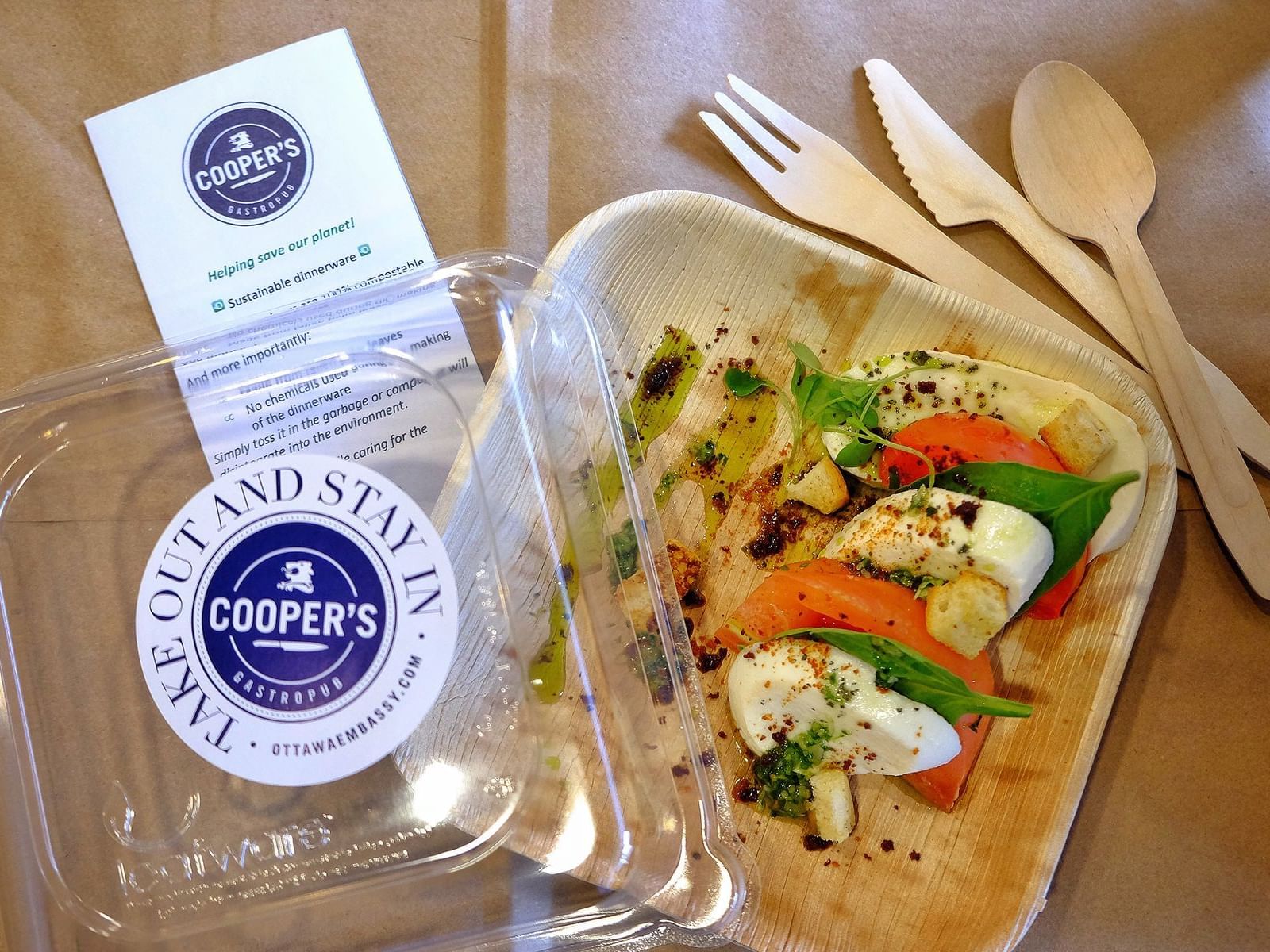 take out box with a caprese salad