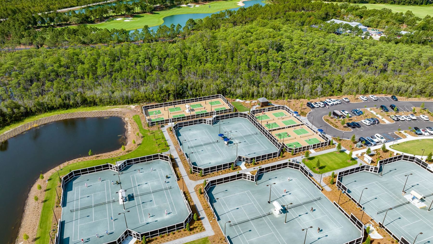 Aerial view of Pickleball courts with lush greenery near Camp Creek Inn