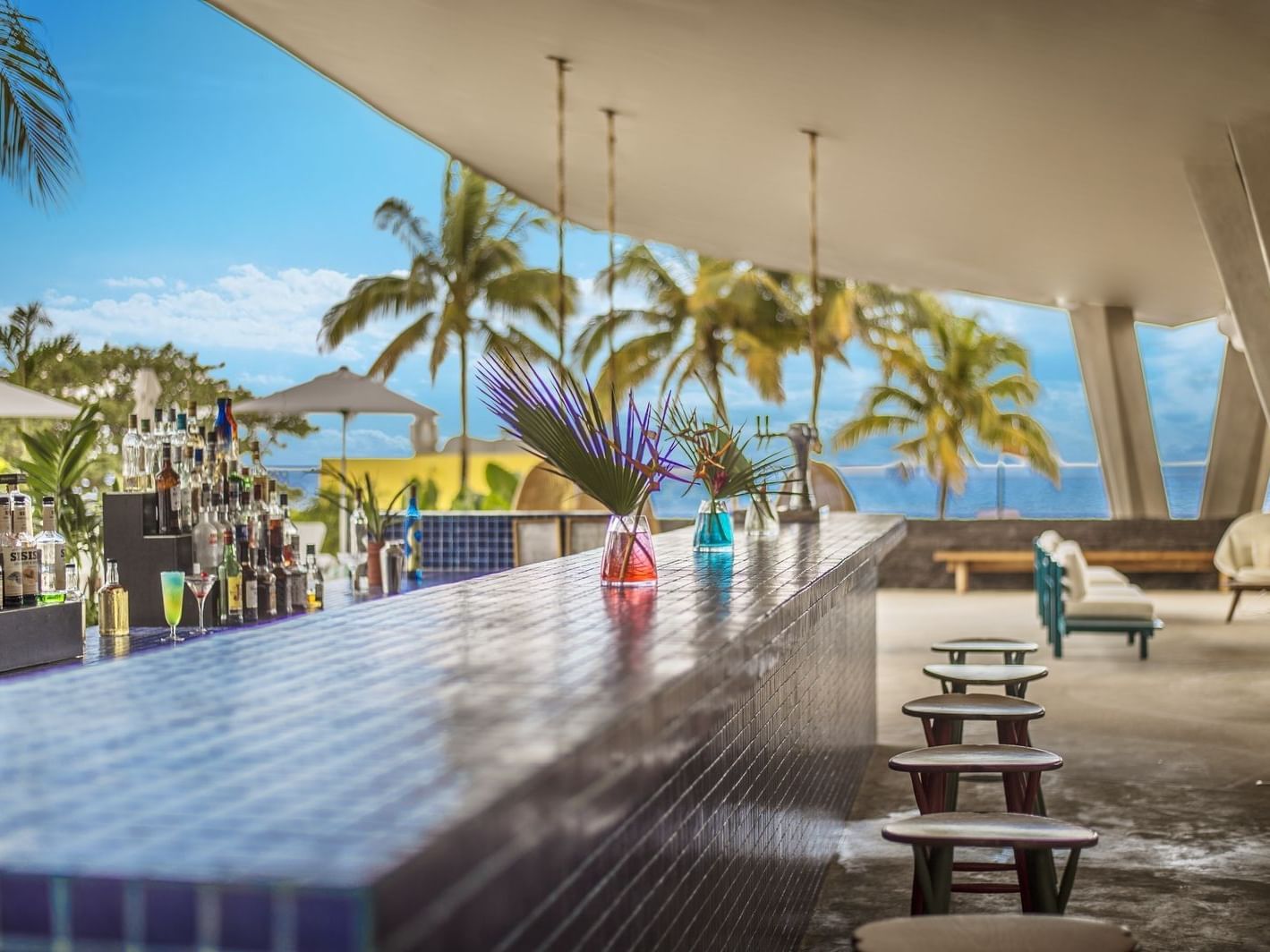 Lobby bar with ocean view at La Colección Resorts